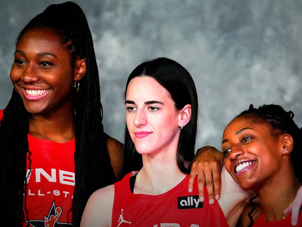 Kelsey Mitchell driving to the basket during an Indiana Fever WNBA game alongside teammate Aliyah Boston